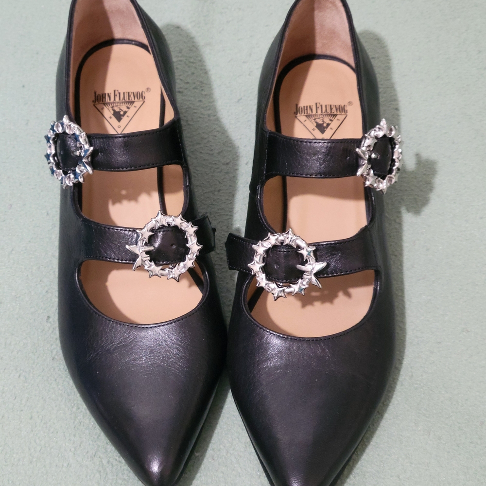 John Fluevog Black Pointed Triple-Strap Mary Jane Flats with Silver Star Buckles
